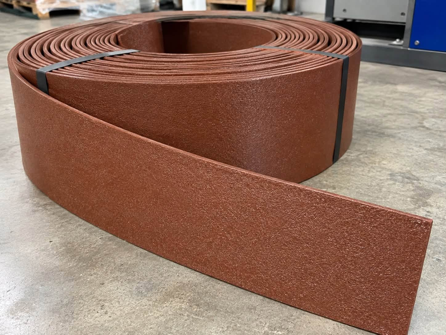 Roll of brown recycled HDPE garden edging